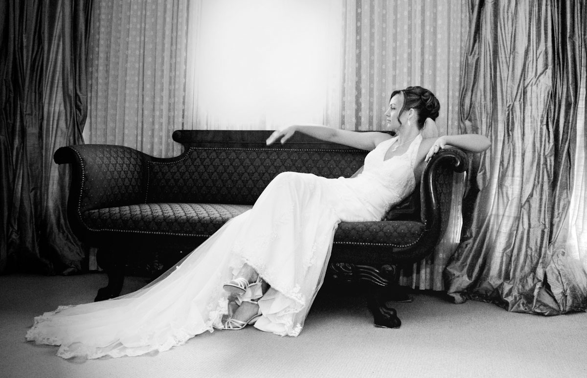 Black & White Wedding Dress, seated on sofa by Window | Boudoir Wedding | Austin, Texas